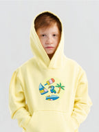 Kid wearing the Summer Vibes patch set on a Hahaha tee