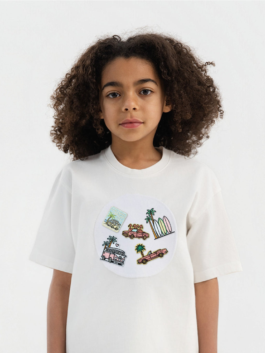 Kid wearing the LA Vibes patch set on a Hahaha tee