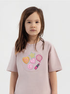 Kid wearing the Girl Power patch set on a Hahaha tee