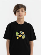 Kid wearing the Space Explorer patch set on a Hahaha tee