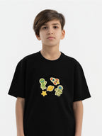 Child wearing organic cotton Hahaha hoodie with Space Explorer collectible patches on swappable zone