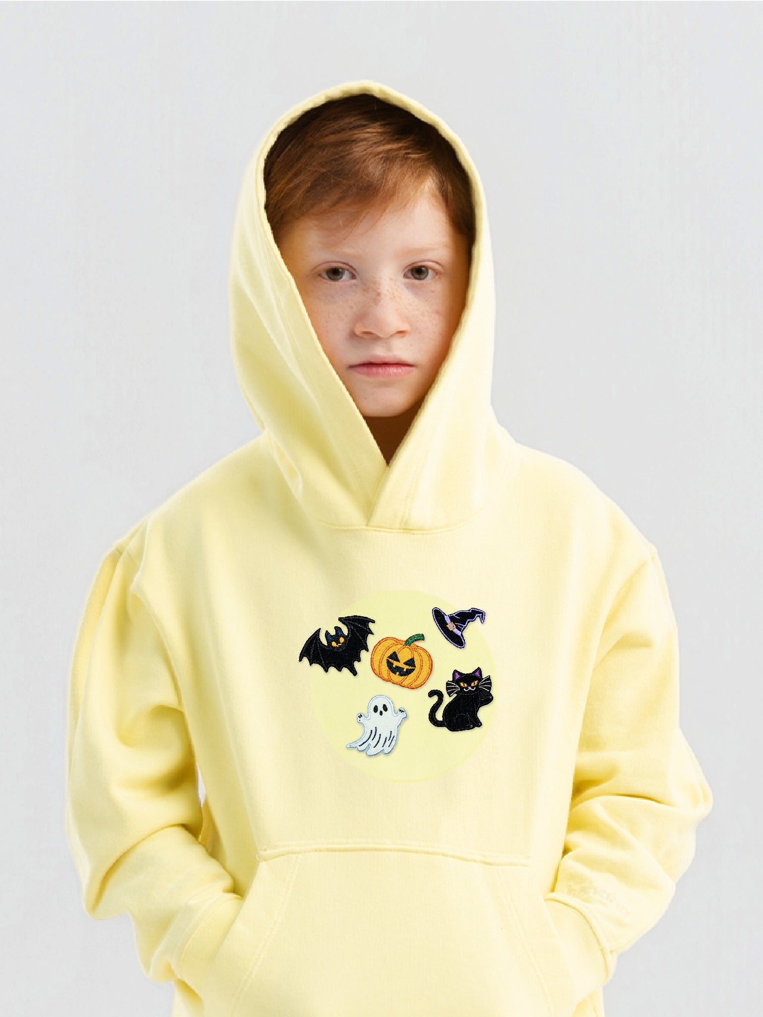 Kid wearing the Spooky Halloween patch set on a Hahaha tee
