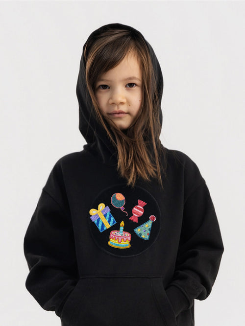 Kid wearing the Birthday Fun patch set on a Hahaha tee