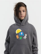 Kid wearing the Safari Snuggles patch set on a Hahaha tee