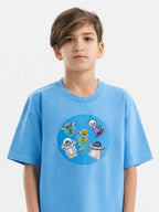 Kid wearing the Alien Adventure patch set on a Hahaha tee