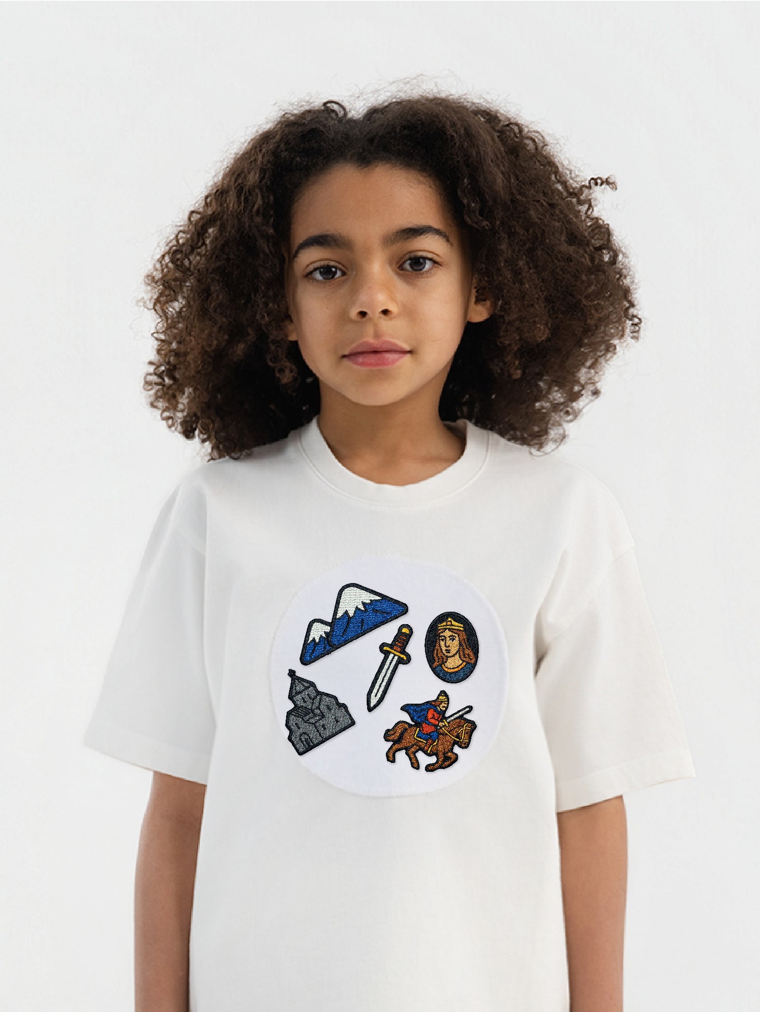 Kid wearing the Armenian Heritage patch set on a Hahaha tee