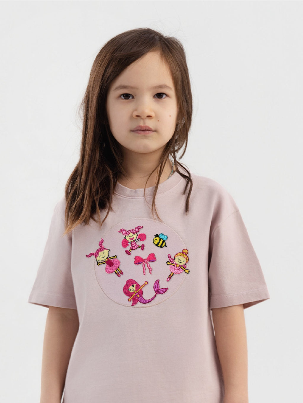 Kid wearing the Ella and the Bee patch set on a Hahaha tee