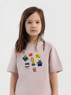 Kid wearing the Little Director patch set on a Hahaha tee