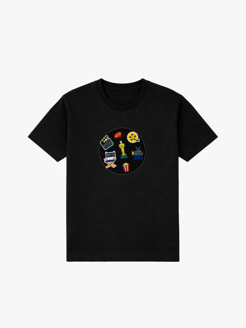 Black organic cotton kids T-shirt with movie-themed embroidered patches: clapperboard, director chair, film reel, popcorn