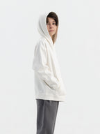 Child wearing off white Hahaha hoodie with collectible patches on swappable circular patch zone