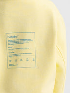 Close-up Hahaha kids hoodie back label - CAUTION CONTAINS SNUGGLES GIGGLES AND PARENTAL AFFECTION