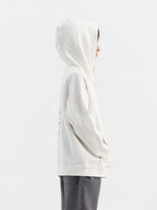 Off White Hahaha organic cotton kids hoodie side profile, child looking over shoulder