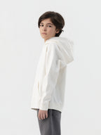 Back of off white Hahaha kids hoodie with CAUTION CONTAINS HIGH LEVELS OF SNUGGLES AND GIGGLES label