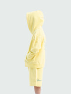 Light Yellow Hahaha organic cotton kids hoodie side view with hood up, made in California