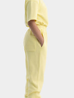 Back view of light yellow Hahaha GOTS certified organic cotton kids jogger pants