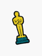 Embroidered Gold Award Statue patch with hook-and-loop backing